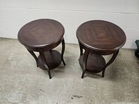 Both round Bombay end tables full view