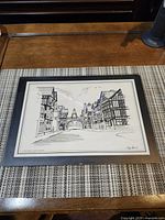 Frontal view of framed Philip Mason print showing image and mat