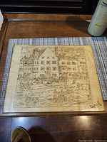 front view of plaque showing full pyrography scene