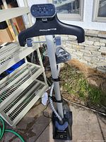 Full view of Rowenta garment steamer with hanger, pole and hose