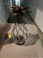 10-inch lantern unwrapped showing bronze metal, glass body, lattice, hang tag