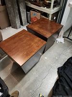 Two cube end tables side by side showing tops and side panels
