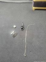 All four single sterling pieces laid out