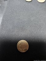 Obverse of the 1880 Indian Head cent, minimal detail visible