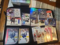 Overall layout of all 18 sleeved rookie cards