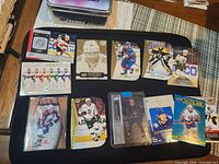 Lot overview showing all hockey trading cards on mat