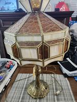 Full view of lamp showing stained glass shade and base