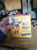 Front view of yellow Walt Disney Home Movie Cartoons sleeve featuring Mickey Mouse