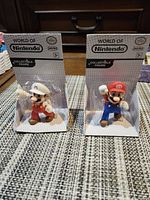 Both boxed Mario figures front view