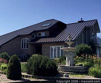 Example home with metal roofing illustrating services covered by certificate