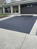 Example of freshly sealed asphalt driveway