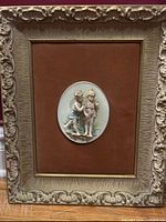 Front view first framed porcelain cherub plaque