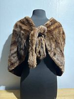 Front view of brown mink fur capelet on mannequin