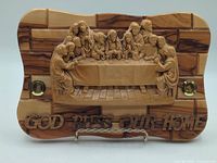 Front view of olive wood plaque showing Last Supper carving, inscriptions and reliquaries