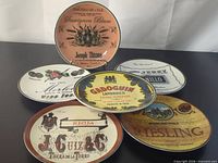All six plates displayed to show each unique wine label design