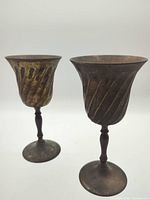 Two brass goblets front view showing size and design