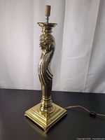 Full view of brass lion table lamp