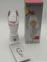 Aerator assembled on stand with box and booklet visible