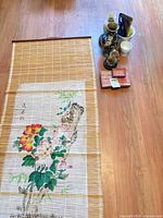 Group view: bamboo wall mat and assorted porcelain items