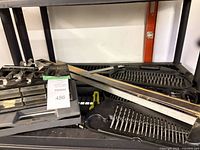 Overview of tools: levels, bit trays on shelf