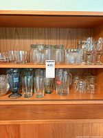 Overall view of shelves with assorted glassware pieces