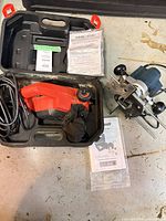 Planer in carry case with paperwork, router beside