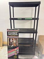 Full view of assembled 5-shelf unit with boxed organizer beside it