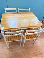 Top view of table and four chairs showing finish and overall design