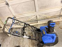 Full side view of Kobalt snow blower folded handle and chute