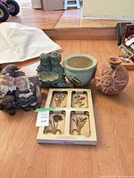 Group shot of entire lot: plaques box, two figurines, planter, vase
