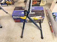 Roller stand beside boxed jointer