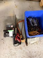 Overall lot with chainsaw, saws and tote of tools