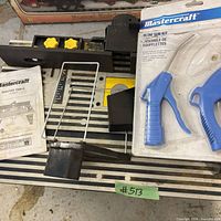 Top view showing router fence, manual, sealed air blow gun kit and hardware