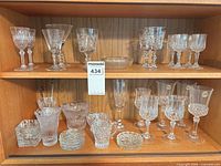 Full view of all crystal pieces on two shelves