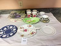 Overall lot showing assorted plates, mugs, teacups, saucers, jasperware pieces and cake server