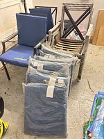 stacked metal chairs with wrapped cushions