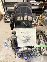 Scooter front with basket, manual, charger visible