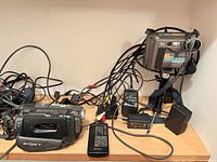 Overall view of both cameras, remote, cables, power adapters