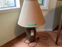 Full view of lamp with shade showing form and cord