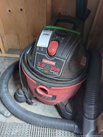 Top view of Craftsman 209 shop vac showing model label, power switch, carry handle, hose connection and cord