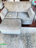 Front view of loveseat with ottoman