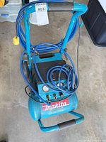 Full view of Makita MAC5200 compressor with hose and cord