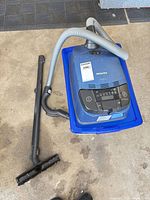 Canister vacuum with hose, wand, floor brush