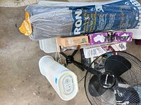 Group shot showing rolled underlay, pedestal fan base, tower purifier, bulb boxes and accessories