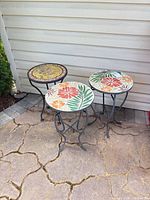 Front view of all three mosaic top stands