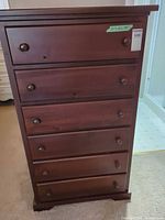 Front view showing all six drawers and overall finish