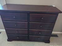 Front view showing all eight drawers and knobs