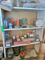 Shelving with jars and packaged screws, nails, small hardware