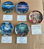 Six plates laid out with their certificates