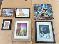 All six framed prints laid out on cardboard